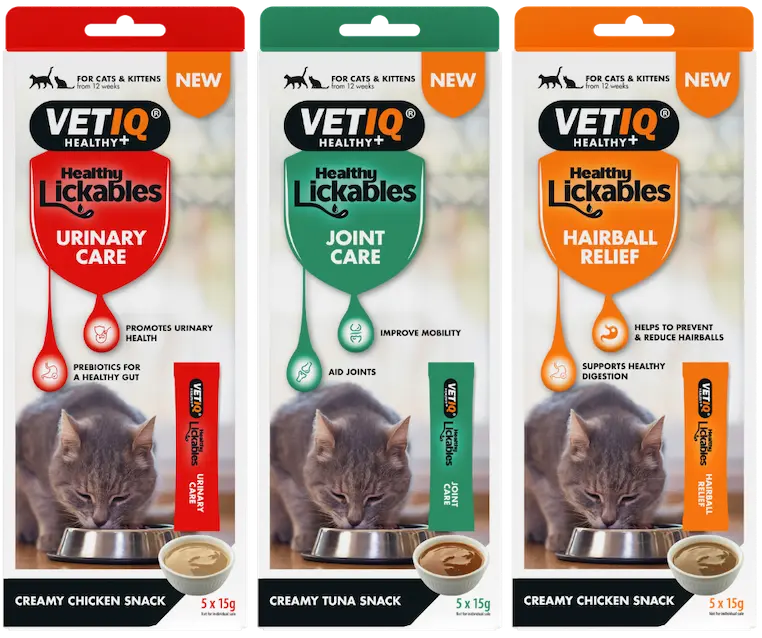 Three VetIQ Healthy Lickables snack boxes for cats: Urinary Care (red), Joint Care (green), and Hairball Relief (orange), each showing a cat bowl image and product name.